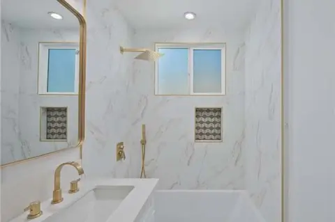 Bathroom vanity with brass fixtures, Encino remodel